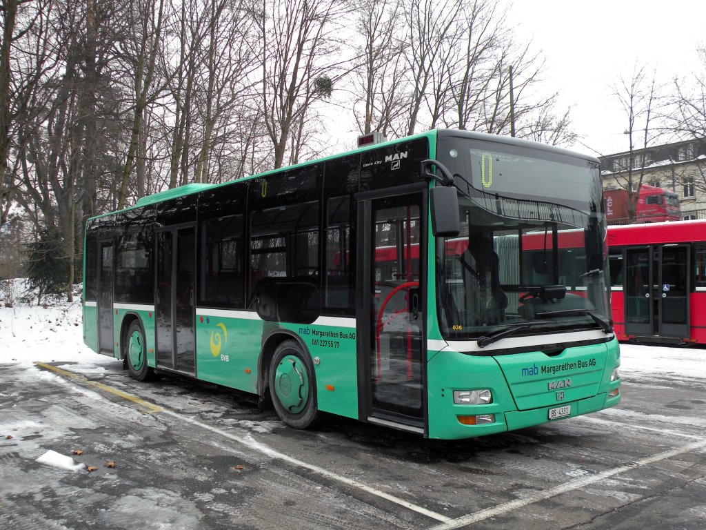 MAN Lion's City mit der Betriebsnummer 036 der Margrethen Bus AG auf einem Parkplatz in der Nhe des Zeughauses in Basel. Die Aufnahme stammt vom 13.02.2012.