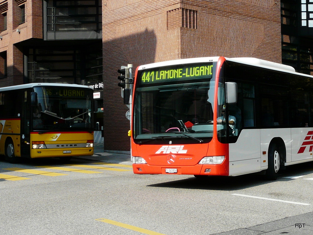 Postauto /  ARL - Setra und Mercedes Citaro  Nr. 14  TI 143814 unterwegs auf der Linie 441 in der Stadt Lugano am 30.09.2011