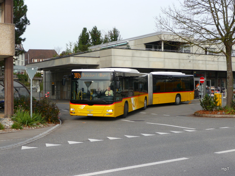 Postauto - MAN Lion`s City  BE 610550 unterwegs auf der Linie 365 in Aarberg am 20.11.2010