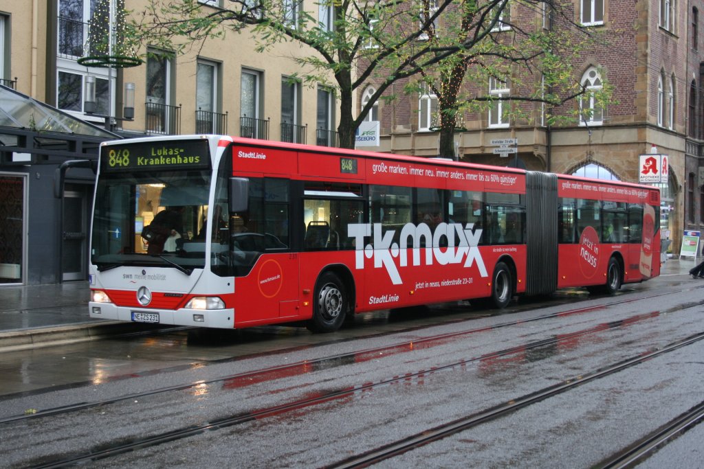 SWN 231 (NE ZS 231) mit Werbung fr T.k.maxx mit der Linie 848 zum Lukas Krankenhaus am 28.11.2009.