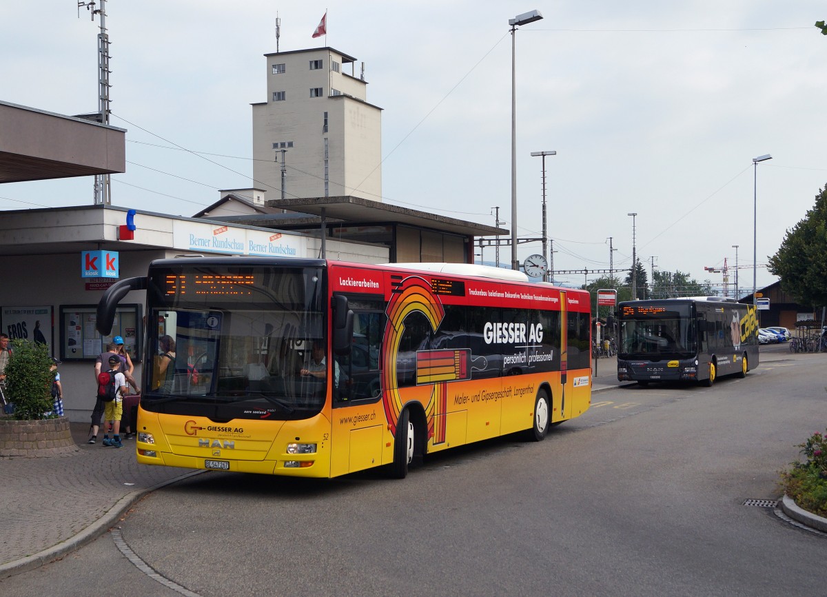 ASm: Die MAN ASm Ueberlandbusse 52 und 43 mit Werbeaufschrift in Herzogenbuchsee am 6. Juli 2015:
Foto: Walter Ruetsch