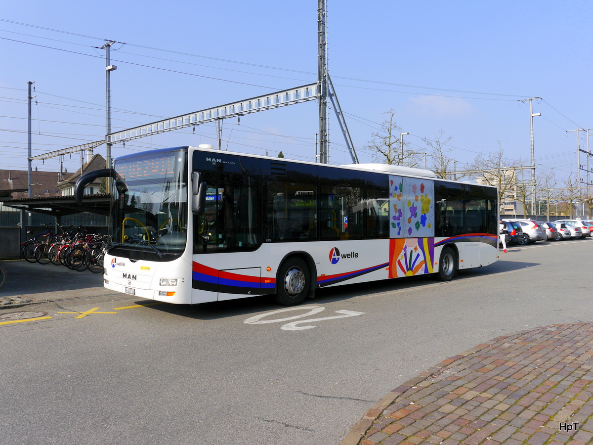 Postauto - MAN Lion`s City AG 208700 unterwegs beim Bahnhof Wohlen am 11.03.2016