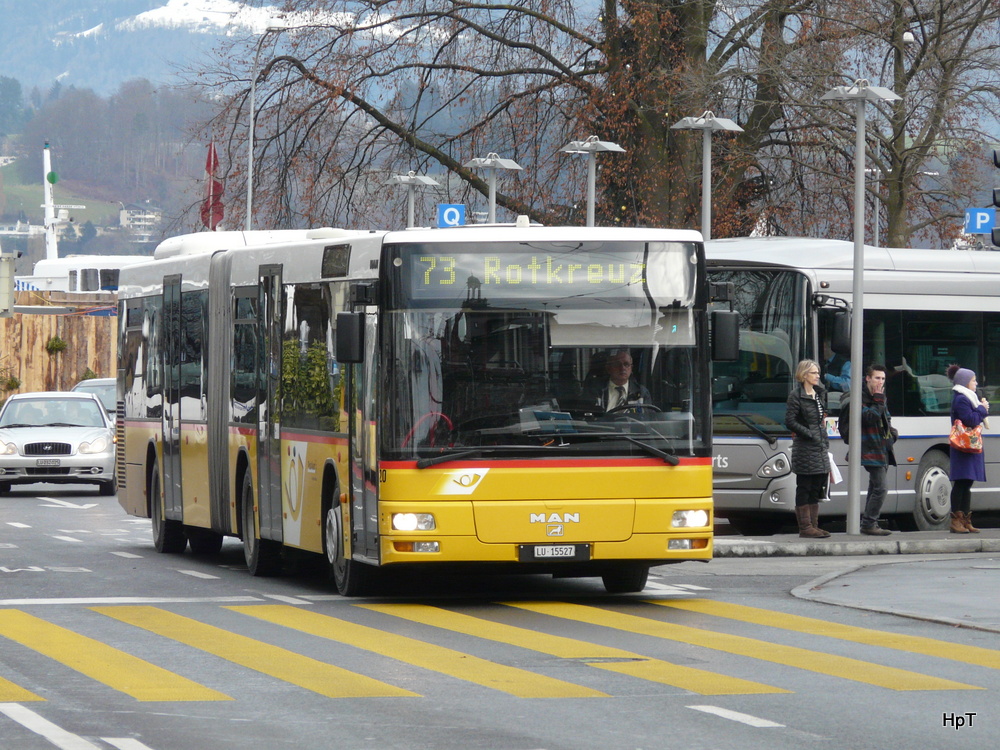 Postauto - MAN  LU 15527 unterwegs in der Stadt Luzern am 03.01.2014