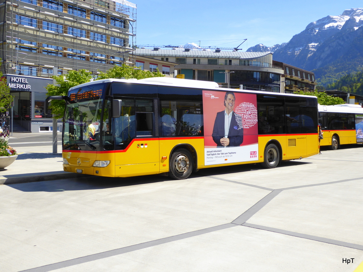 Postauto - Mercedes Citaro  BE  610532 bei den Bushaltestellen vor dem Bahnhof in Interlaken West am 06.05.2016