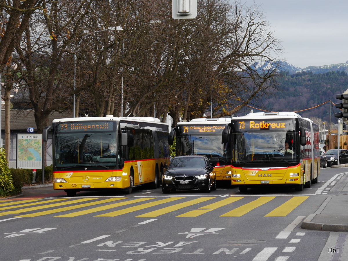 Postauto - Mercedes Citaro und MAN Lion`s City unterwegs vor dem Bahnhof Luzern am 01.12.2015