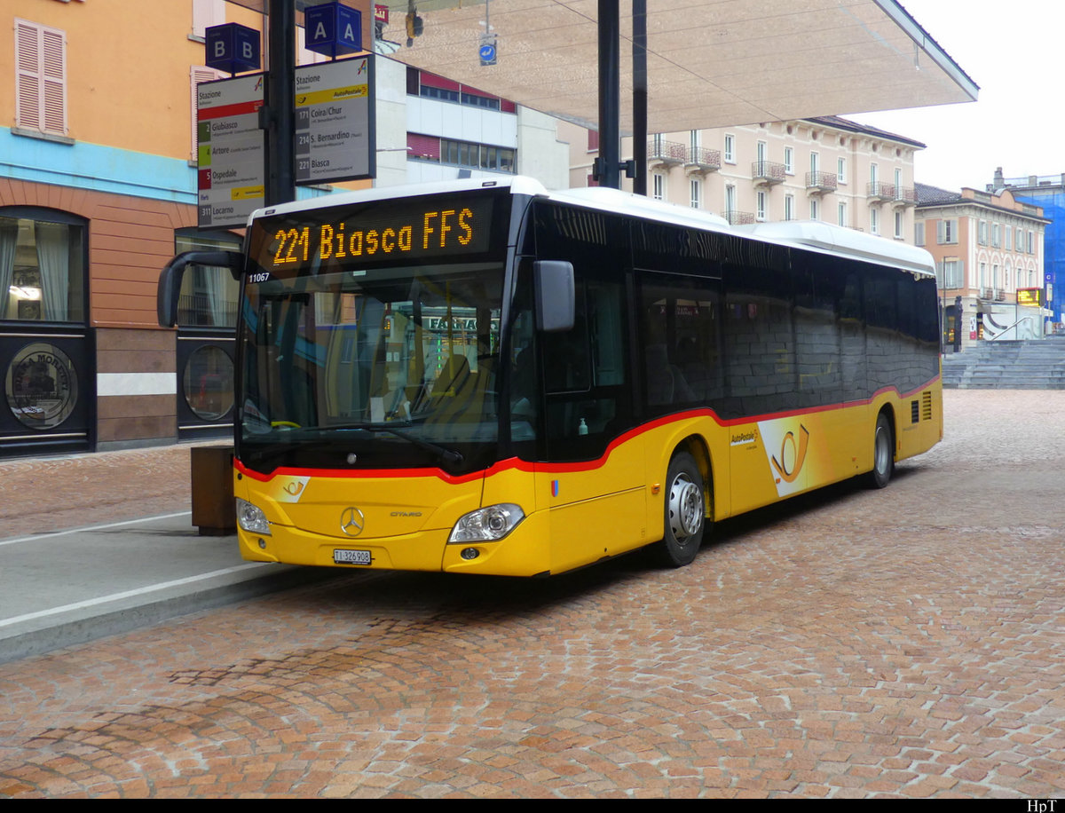 Postauto - Mercedes Citaro TI 326908 in Bellinzona bei den Bushaltestellen beim Bahnhof am 12.02.2021