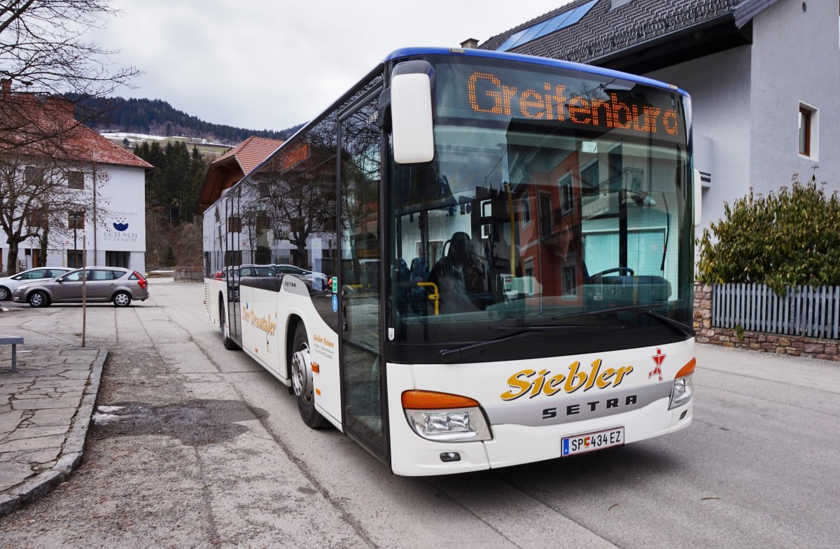 Setra S 415 NF von Siebler Reisen, unterwegs auf der Kfl. 5021 als Kurs 11 (Oberdrauburg Bahnhof - Gerlamoos), am 16.3.2016 beim Halt an der Haltestelle Dellach im Drautal Gemeinde.
