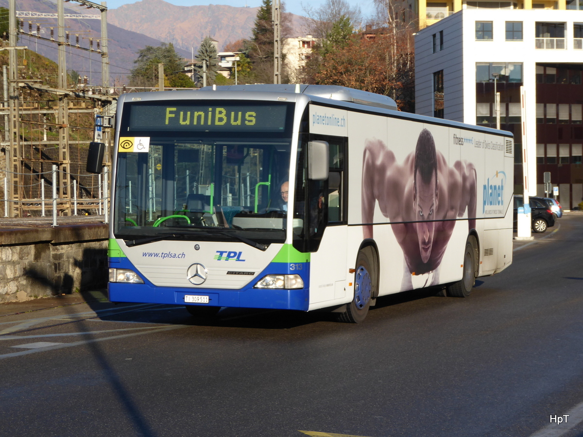 TPL - Mercedes Citaro Nr.313  TI 309511 unterwegs auf der Linie FINI BUS in beim Bahnhof Lugano am 25.12.2015