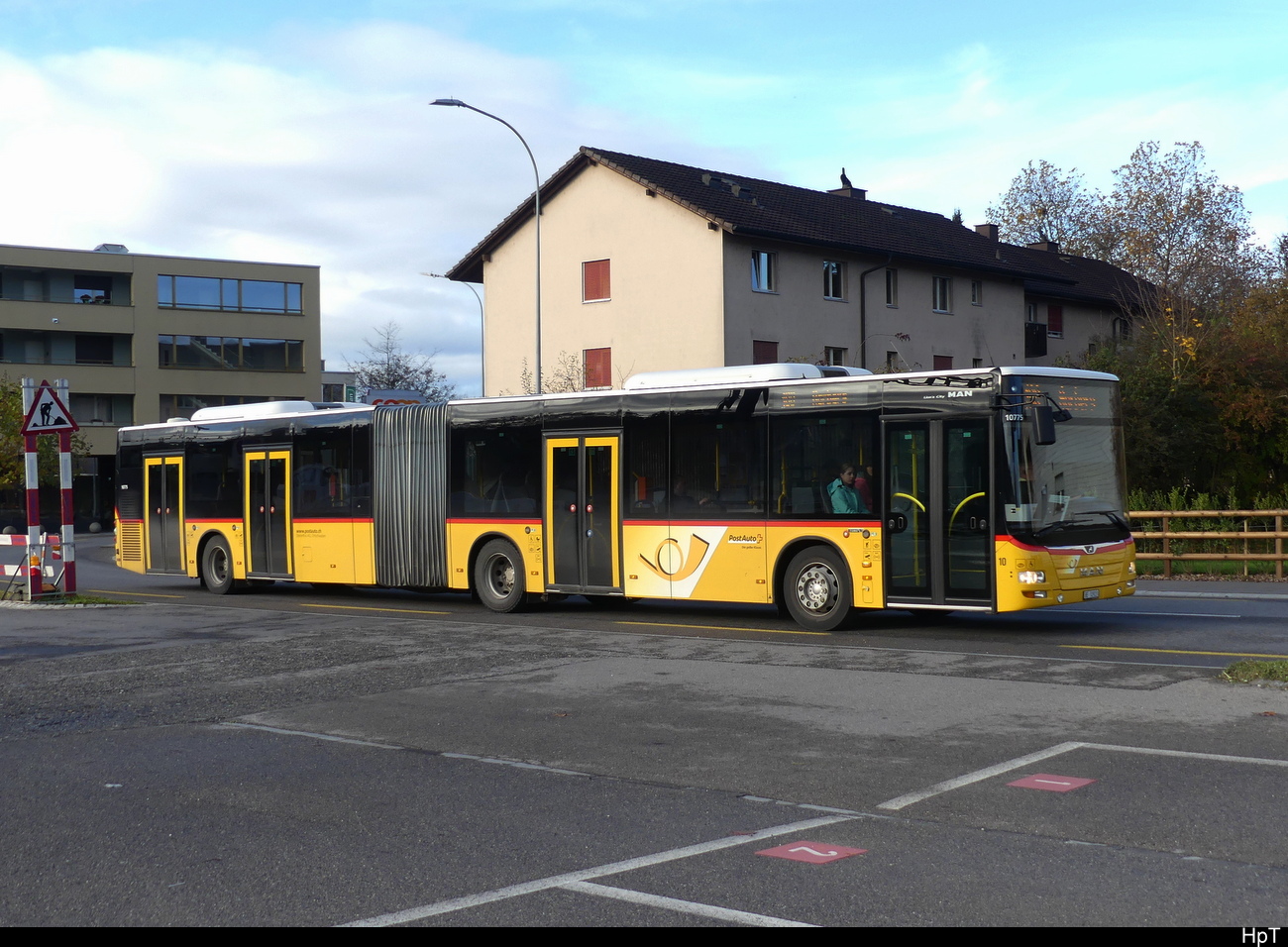 Postauto - MAN Lion`s City BE  32923 unterwegs in Aarberg am 19.11.2022