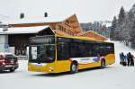 MAN Lions City von Grindelwald Bus auf der Linie 11 beim Hotel Wetterhorn oberhalb von Grindelwald. Die Aufnahme stammt vom 29.12.2014. 