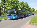 Mehrere Fahrzeuge der Oberhavel Verkehrsgesellschaft mbH, am Anfang OHV-VK 131 auf der Strecke am U-Bahnhof Rudow für Shuttle Fahrten zur ILA 2018 am 28. April 2018.