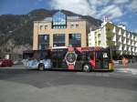 Solaris Bus der Post mit der Vollwerbung fr HAMILTON Uhren kurz vor dem Bahnhof Interlaken Ost. Die Aufnahme stammt vom 18.04.2013.