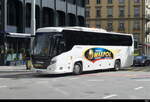 Reisebus von Bialas Maxpol - Weisser Scania Touring unterwegs in der Stadt in Genf am 24.03.2024