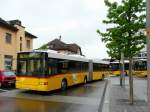 Postauto Postauto - Volvo-Hess  JU 49766 bei der Ausfahrt von den Postautohaltestellen gegen�ber dem Bahnhof von Delemont am 11.05.2009