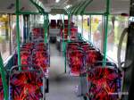 man-niederflurbus-3-generation-lions-city Innenansicht eines MAN A21 in der Stadtausf�hrung. Dieses Fahrzeuginnendesign ist allerdings noch aus der vorletzten Lieferung. Neuerdings sind die Haltestangen silber und die Sitzpolster weisen ein anderes Muster auf.