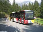 Kt. Graubunden MAN A35 GR 161 644 (PU Stuppan) in Fidaz, Waldrand. Da die Strasse oberhalb Flims sehr eng ist, muss der Chauffeur hier noch auf den Gegenkurs warten.
