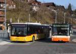 Postauto Eurobus, Bern BE 649'004 MAN und RBS, Worblaufen Nr. 18/BE 465'718 MAN am 16. M�rz 2010 beim Bahnhof Bolligen.