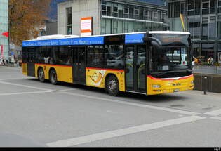 Postauto - MAN Lion`s City BE 718991 in der Pause vor dem Bhf.