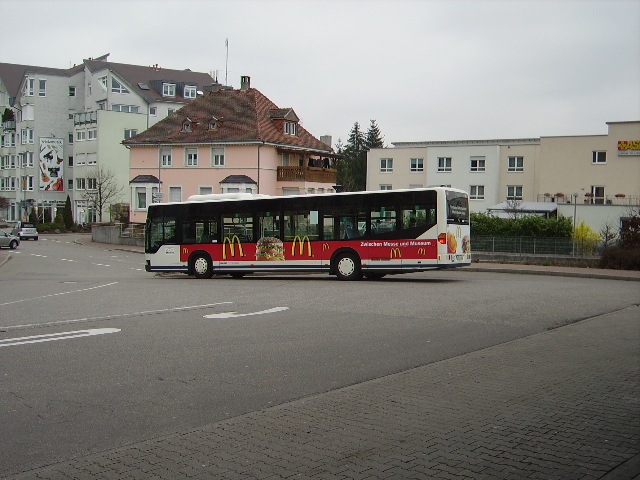 Ein SWEG Citaro mit Mc Doff Werbung in Sinsheim Hbf am 18.03.11