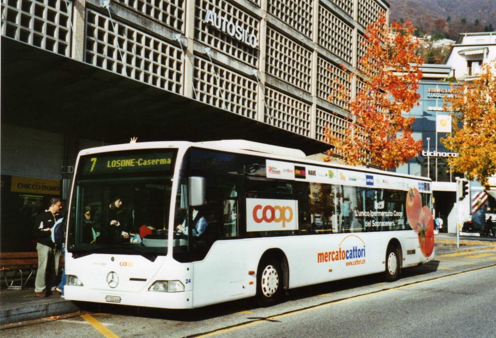 FART Locarno Nr. 24/TI 312'424 Mercedes Citaro am 21. November 2009 Locarno, Bahnhof (mit Vollwerbung fr  mercatocattori )