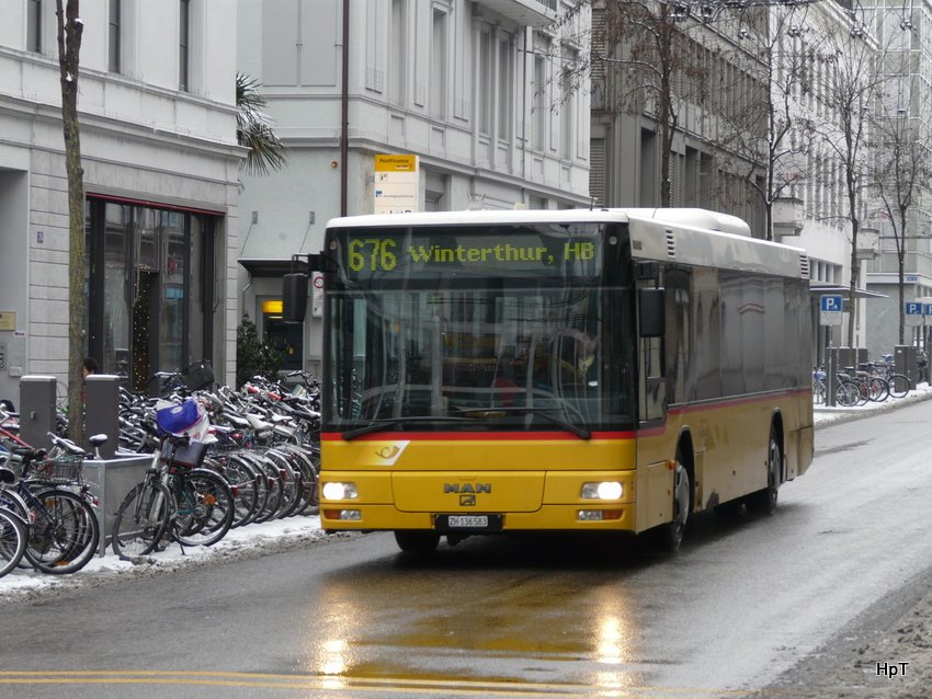 Postauto - MAN ZH 136582 unterwegs auf der Linie 676 in der Stadt Winterthur am 10.01.2010