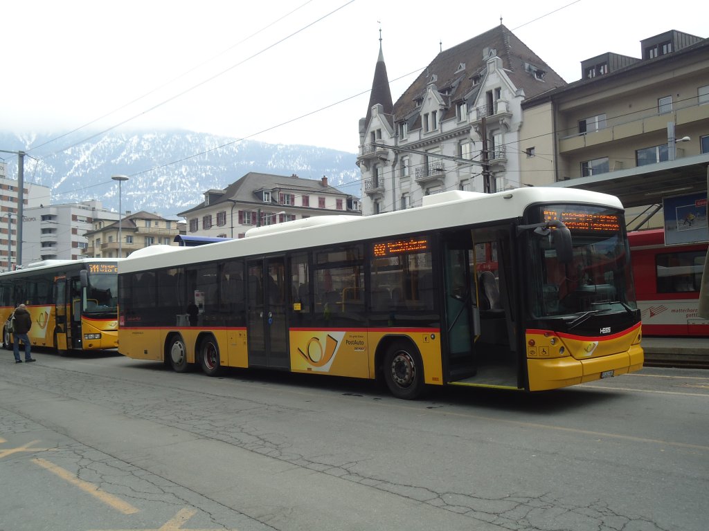 PostAuto Wallis - VS 241'983 - Scania/Hess am 19. Februar 2012 beim Bahnhof Brig