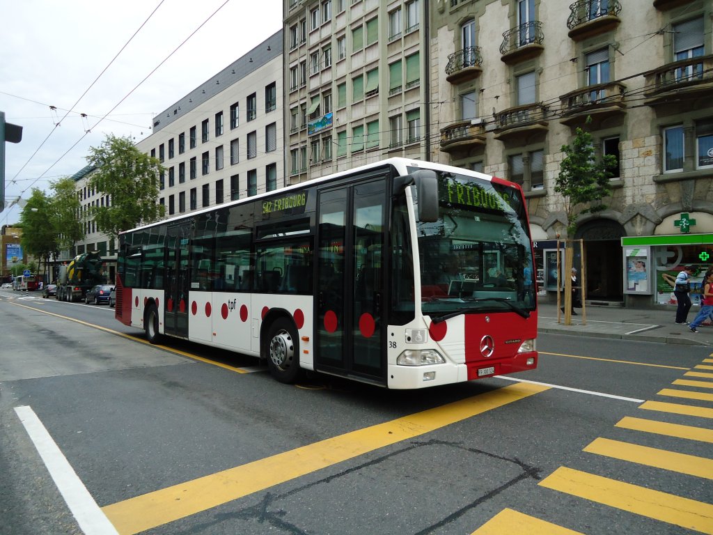 TPF Fribourg Nr. 38/FR 300'324 Mercedes Citaro am 26. Juli 2010 Fribourg, Bahnhof