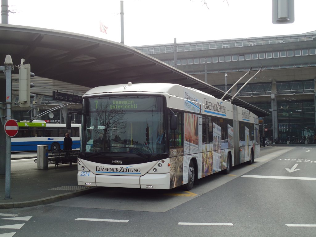 VBL Luzern - Nr. 224 - Hess/Hess Gelenktrolleybus am 11. Mrz 2011 beim Bahnhof Luzern (mit Vollwerbung fr  Neue Luzerner Zeitung )
