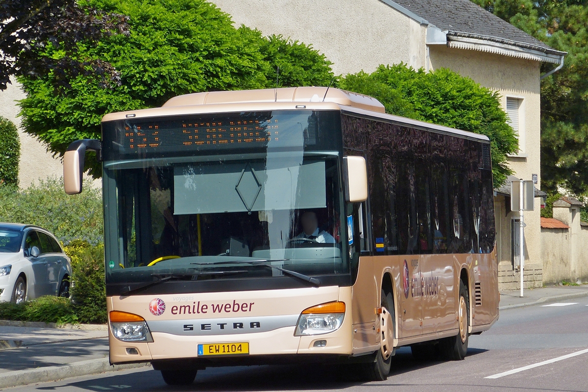 . EW 1104, Setra S 415 NF, von Emile Weber gesehen am 17.09.2014 in der Nähe von Remich.