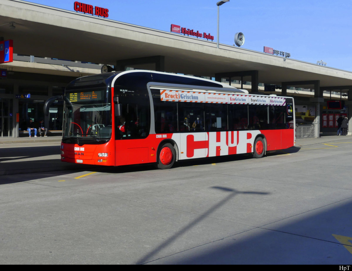 Chur Bus - MAN Lion`s City GR 97513 unterwegs bei den Bushaltestellen vor dem Bahnhof in Chur am 19.02.2021