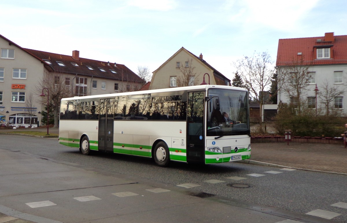Der PM-E 242 der VGB ist ein neuer Mercedes Intouro mit einem Hublift an der Hintertür. Hier am 3.1.2014 am Bad Belziger Busbahnhof auf der Fahrt als Linie 588 zum Bahnhof.