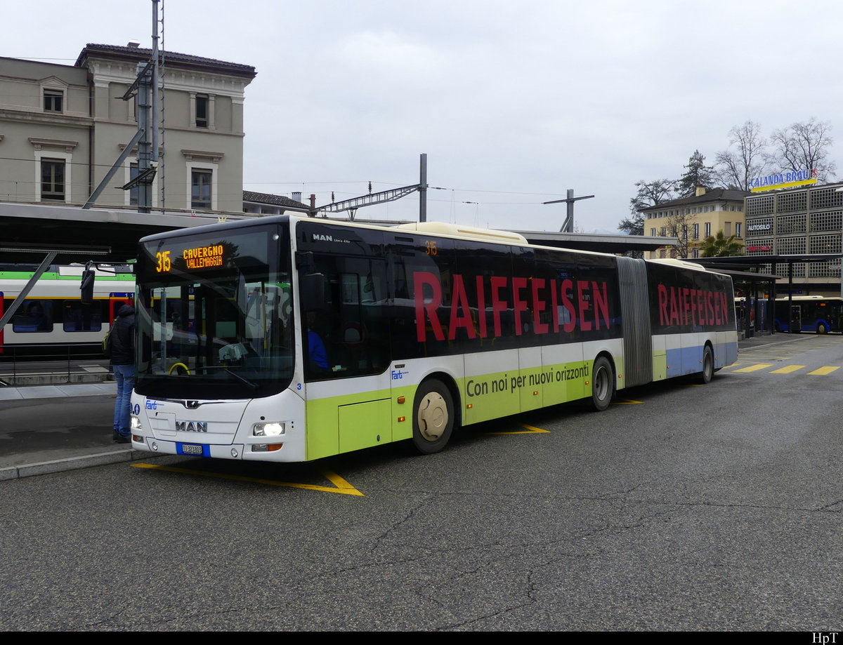 FART - MAN Lion`s City Nr.3  TI 323803 mit Werbung in Locarno vor dem Bahnhof bei den Bushaltestellen am 12.02.2021
