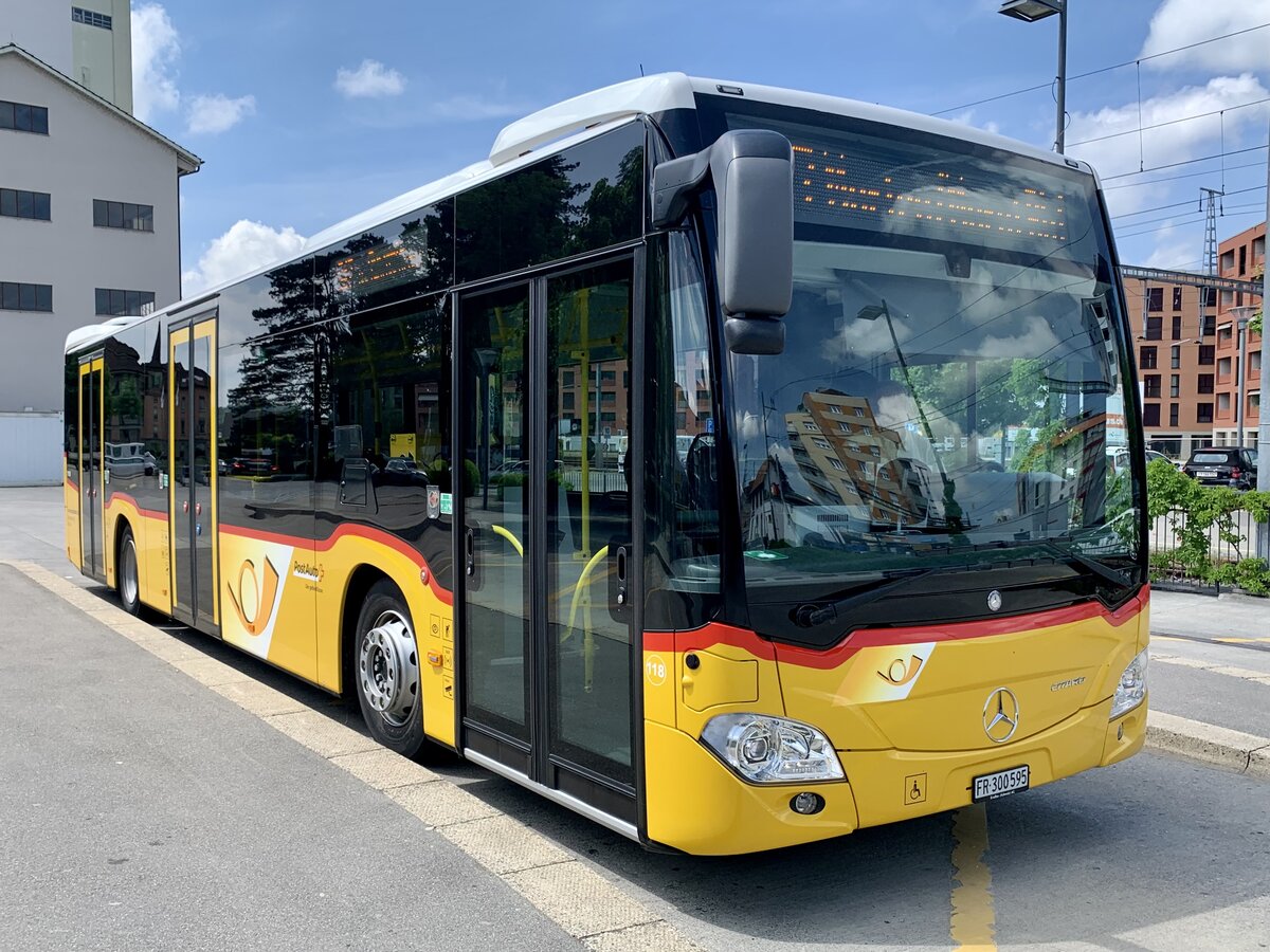 MB C2 hybrid '11558' vom PU Wieland Bus, Murten am 14.5.22 beim Bahnhof Düdingen.