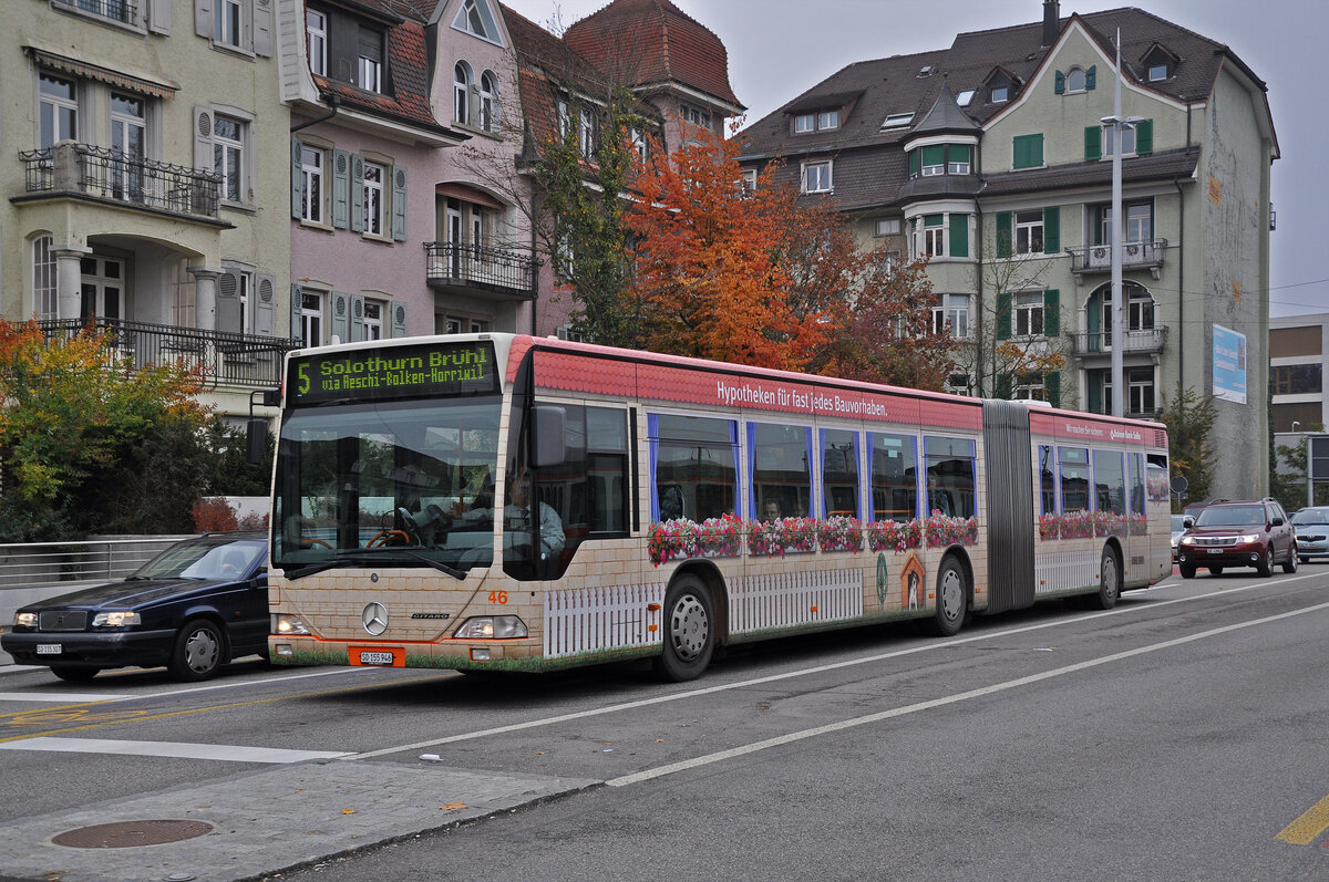 Mercedes Citaro 46 mit der Werbung für die Hypotheken Bank Baloise Bank Soba, auf der Linie 5, fährt am 02.11.2011 zur Haltestelle beim Bahnhof Solothurn.