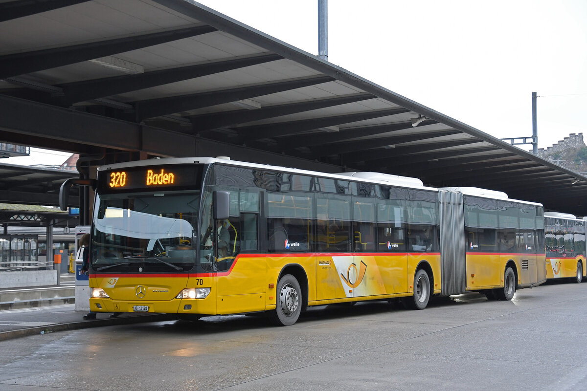 Mercedes Citaro der Post, auf der Linie 320, wartet am 25.01.2023 an der Haltestelle beim Bahnhof Baden.