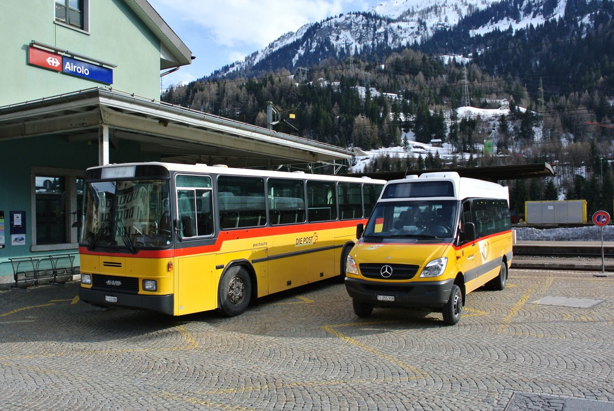 NAW und Mercedes Postauto beim Bahnhof Airolo, 29.03.2014.