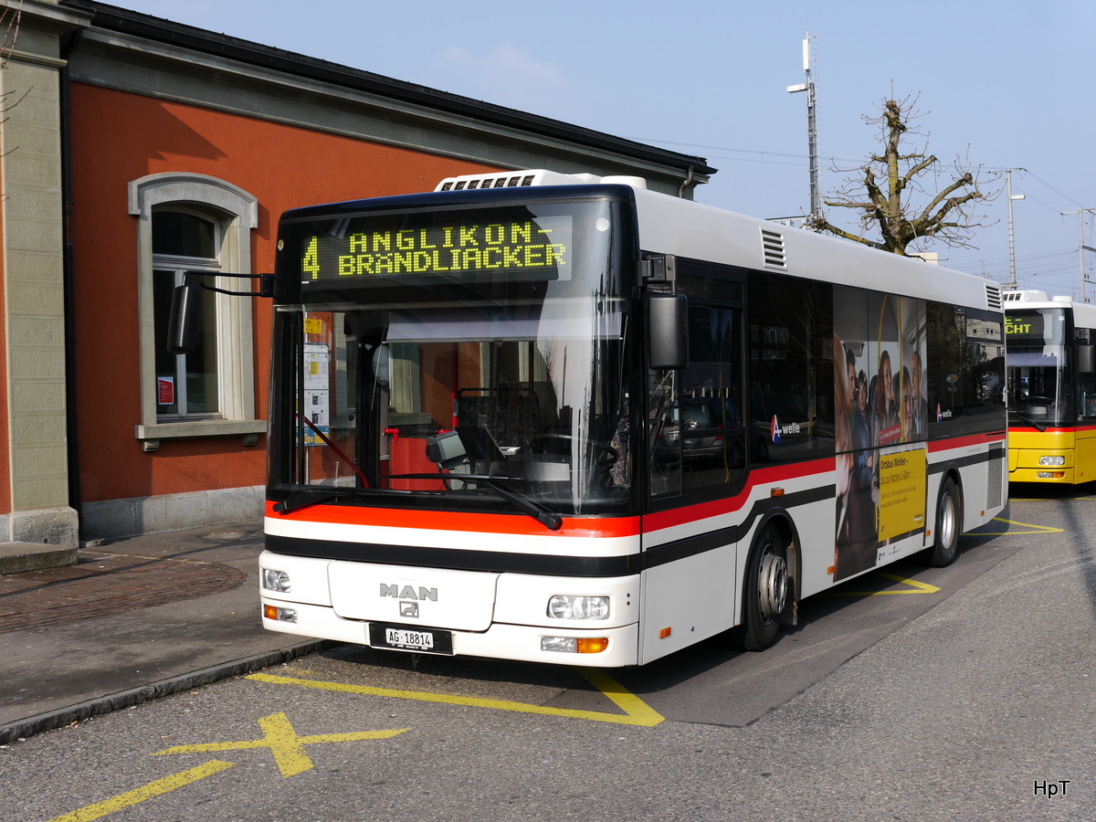 Postauto / Ortsbus Wohlen - MAN AG 18814 unterwegs beim Bahnhof Wohlen am 11.03.2016