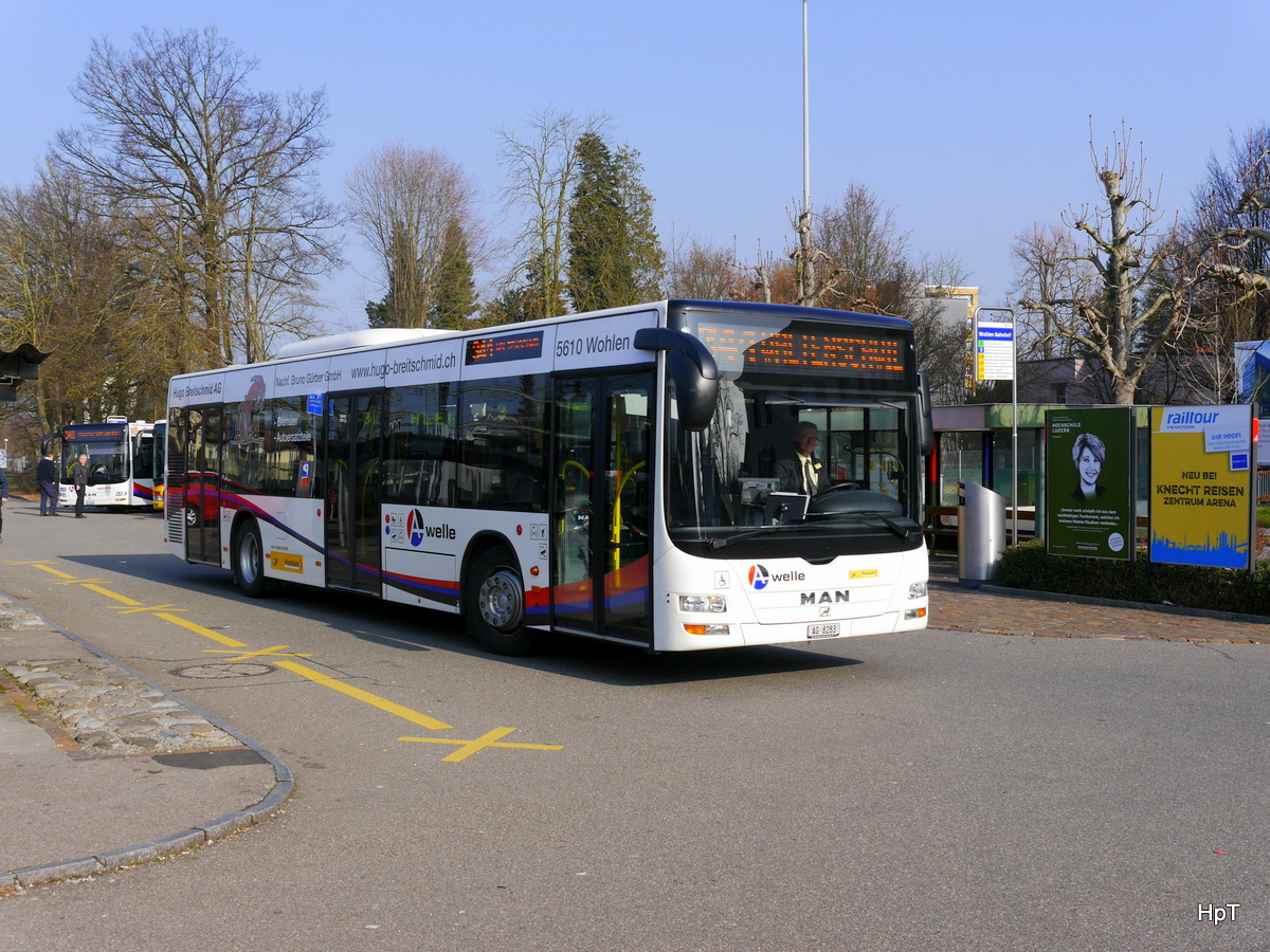 Postauto - MAN Lion`s City AG 8283 unterwegs beim Bahnhof Wohlen am 11.03.2016