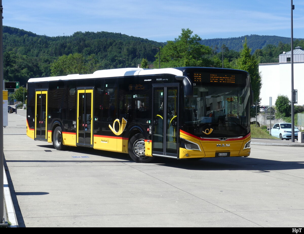 Postauto - MAN Lion`s City Hybrid  BL  224303 in Laufen beim Bahnhof am 2022.07.03