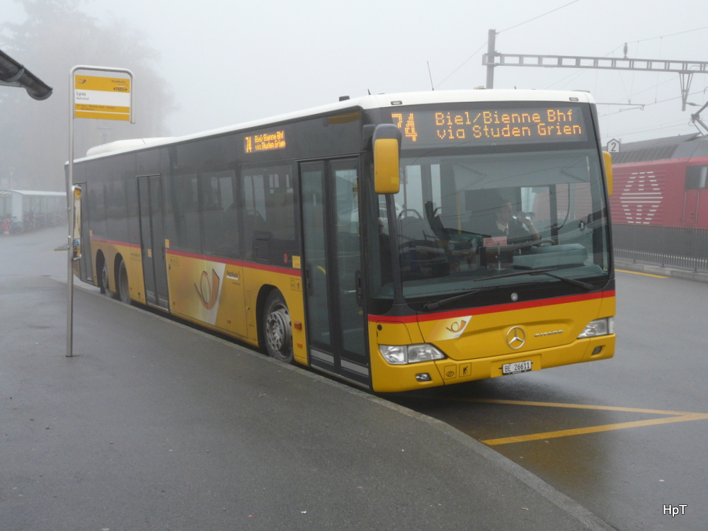 Postauto - Mercedes Citaro  BE  26611 unterwegs auf der Linie 74 beim Bahnhof Lyss am 15.12.2013