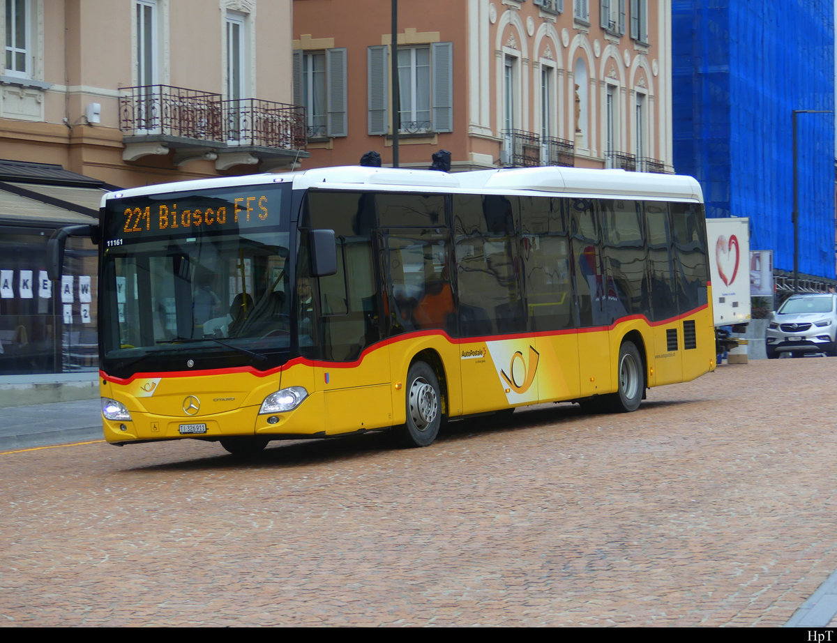 Postauto - Mercedes Citaro TI 326911 in Bellinzona bei den Bushaltestellen beim Bahnhof am 12.02.2021