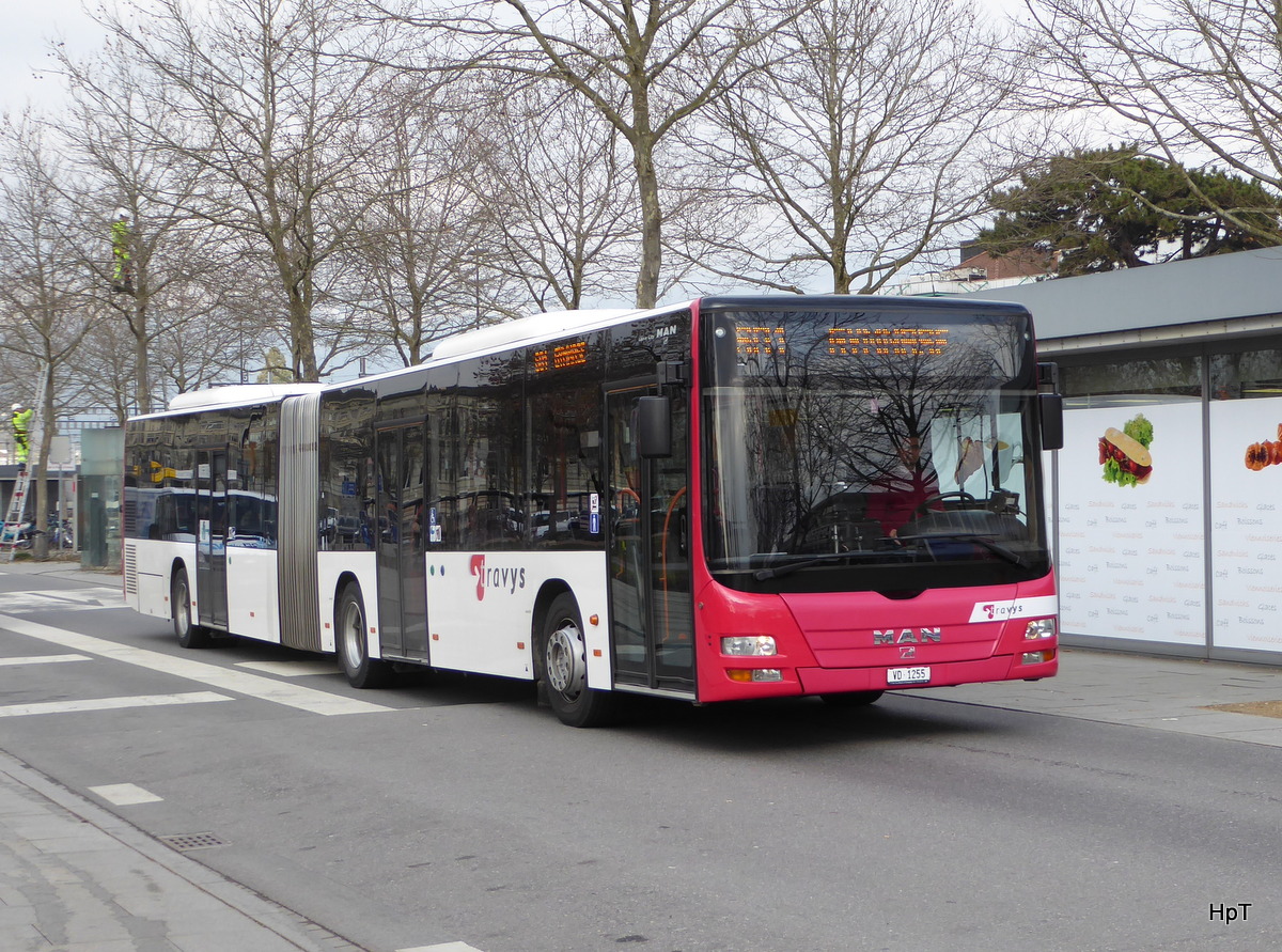 travys - MAN Lion`s City  VD  1255 unterwegs vor dem Bahnhof in Yverdon les Bains am 18.02.2016