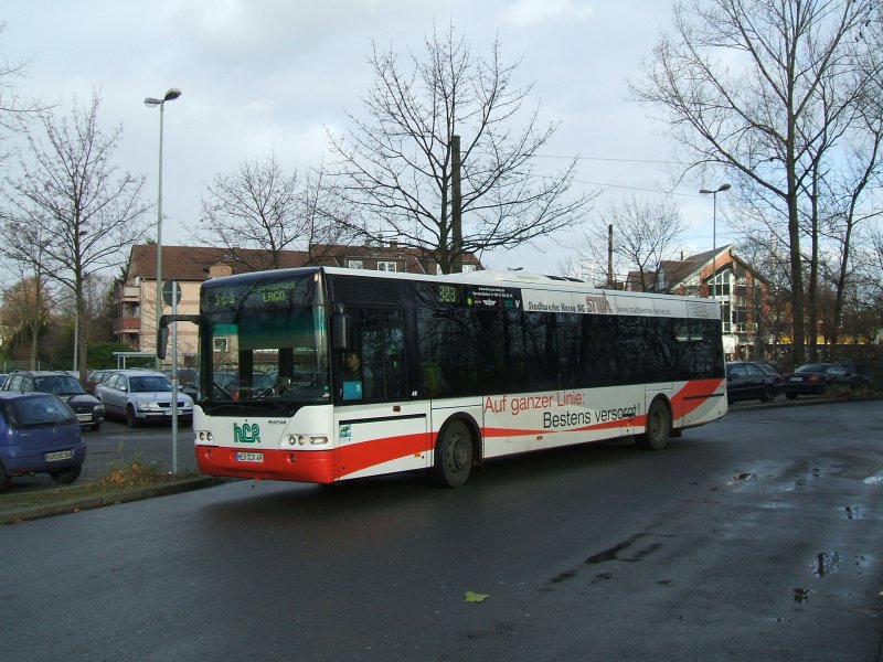 Neoplan , Linie 323 von HCR in Wanne Eickel.(07.12.2007)