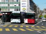 tpf - Hess-Swisstrolleybus  Nr.513  FR 300391 neben Volvo 8700 bei der Haltestellen vor dem Bahnhof in Firbourg am 09.04.2011