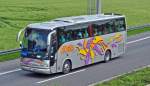 Reisebus aus Tschechien (Modell unbekannt - Aufschrift  Domino 2001  und  HDH Creavo ) auf der A61 bei Weilerswist - 28.05.2010