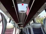 Großes Glasdach und gediegene Sitze im Volvo 9700 von Zwölfer Reisen aus Österreich in Krems.