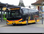 Postauto - MAN Lion`s City Hybrid  BE  675387 bei den Haltestellen vor dem Bhf. Spiez am 09.03.2024