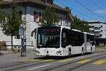 Mercedes Citaro 714 von Intertours, auf der Tramersatzlinie 11, f�hrt am 06.07.2026 durch die Hauptstrasse in Reinach zur Haltestelle Reinach Dorf.