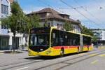 Mercedes Citaro 98 der BLT, auf der Linie 64, f�hrt am 06.07.2026 durch die Hauptstrasse in Reinach zur Haltestelle Reinach Dorf. 