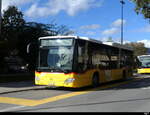Postauto - Mercedes Citaro  VD 464835 auf einem Parkplatz vor dem Bahnhof in Yverdon am 21.10.2023